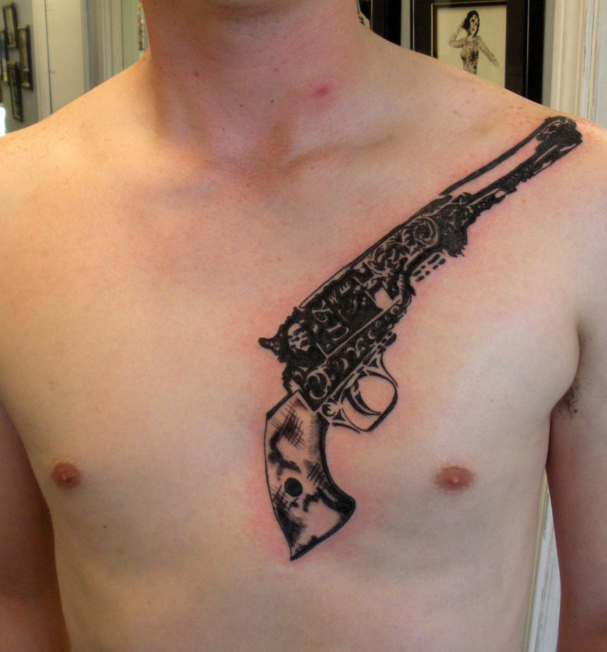 Revolver - chest tattoo