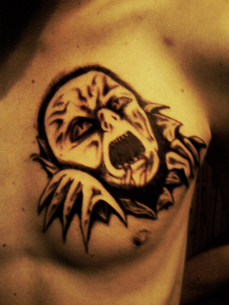 demon chest tattoo by